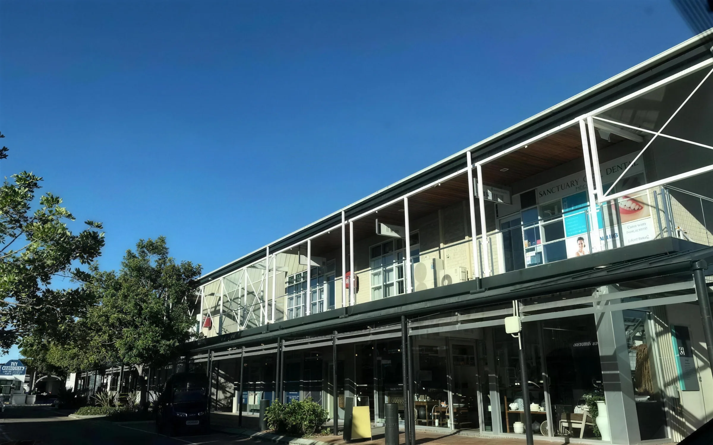 The calm, welcoming reception at the Enhanced Dental Studios Sanctuary Cove clinic near the marina.