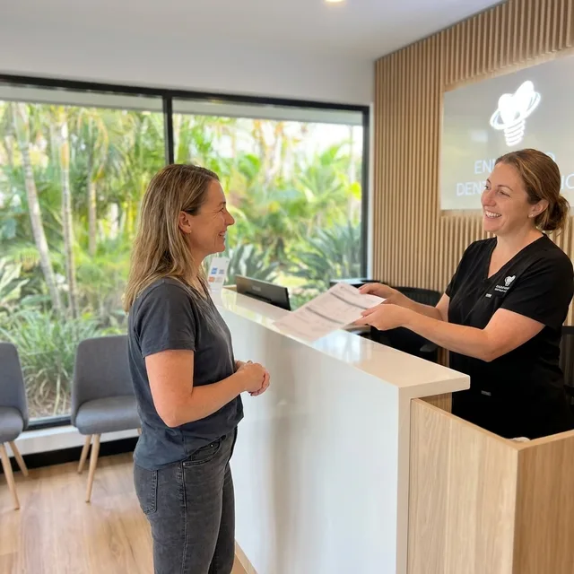 A written, itemised treatment plan handed over at the Enhanced Dental Studios front desk.