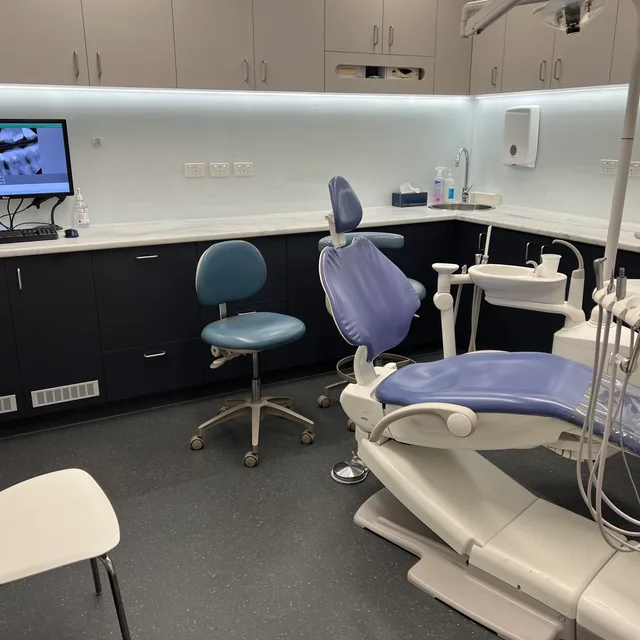 A calm, modern treatment room at Enhanced Dental Studios.