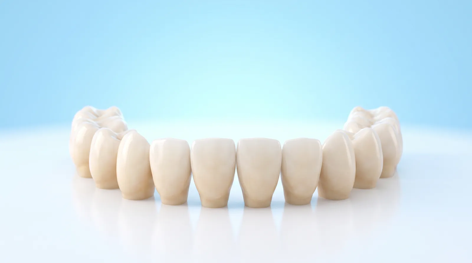 A row of small milk teeth arranged in a neat curve, all clean and sound