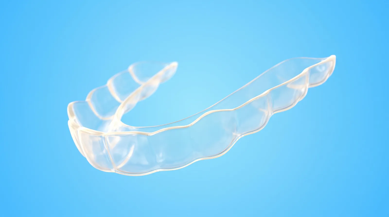 One empty clear aligner tray on its own with nothing inside it